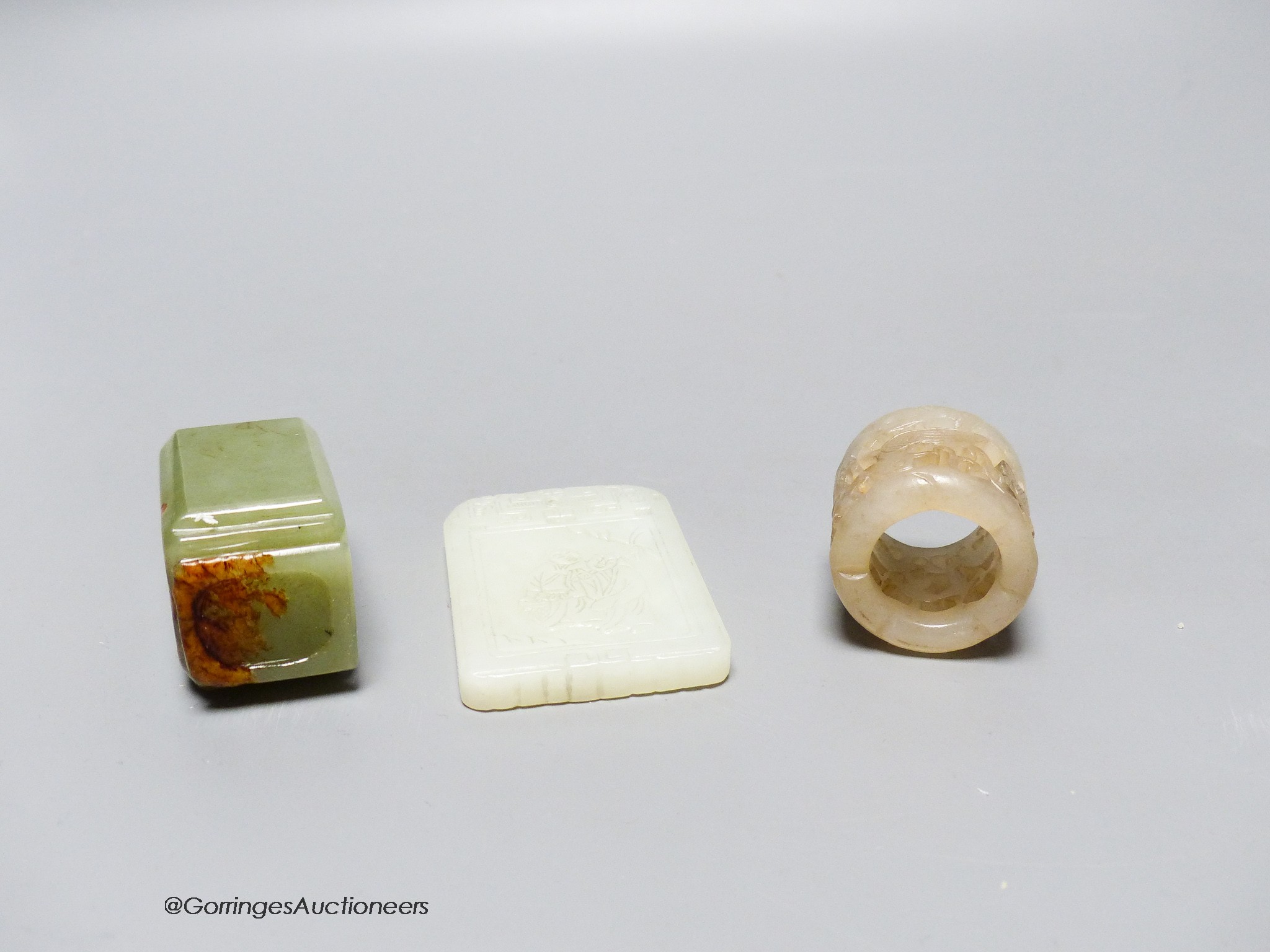 A Chinese jade archer's ring, snuff bottle and plaque, 2.7 - 6cm